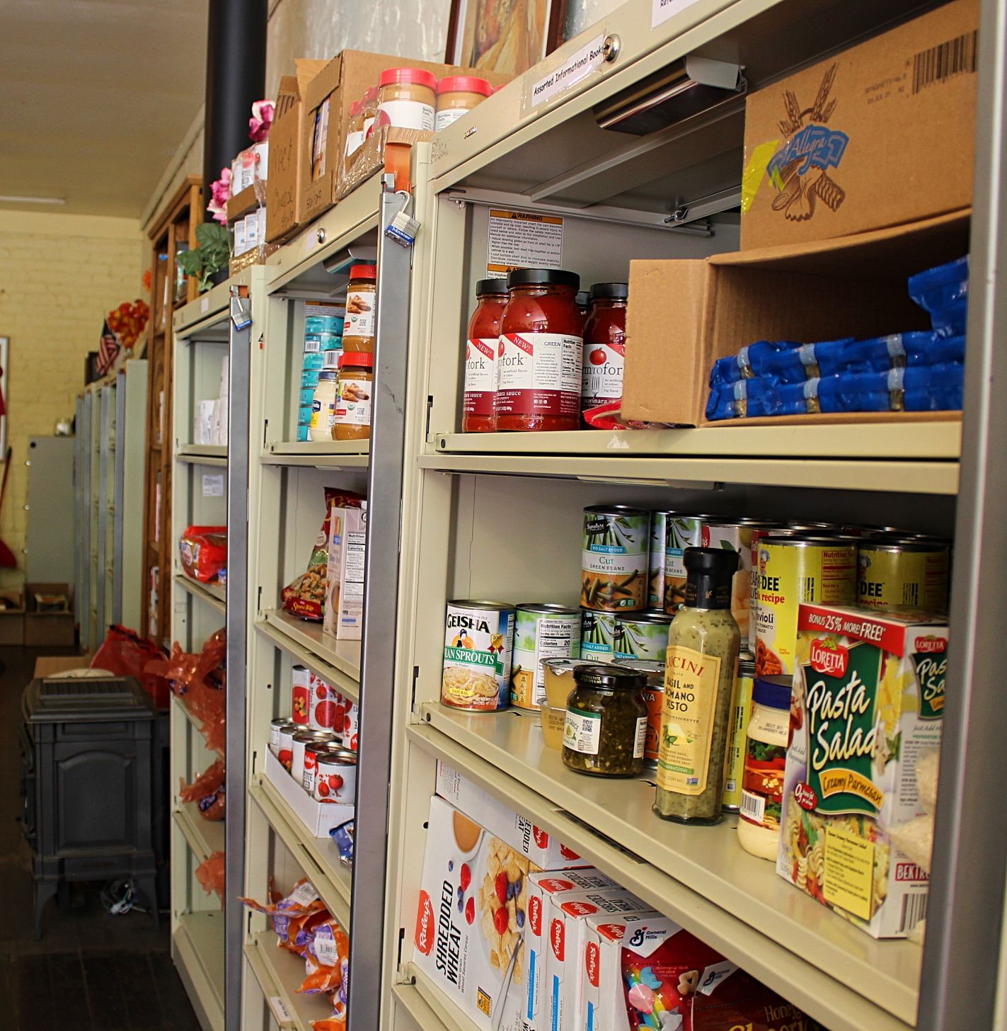 3. Twice a week, the Food Pantry is filled with fresh produce along with staples like pastas, rice, cereal, peanut butter, eggs, tuna, bone broth, teas, tomato sauces and more, distributed by Fiddletowners like these kind ladies. by Dave Gebauer.jpg